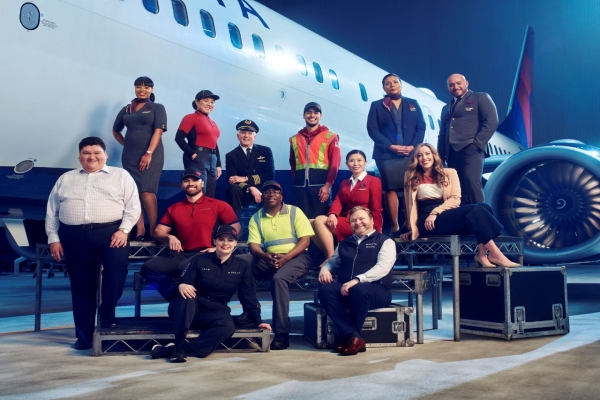 Delta frontline workers in front of plane