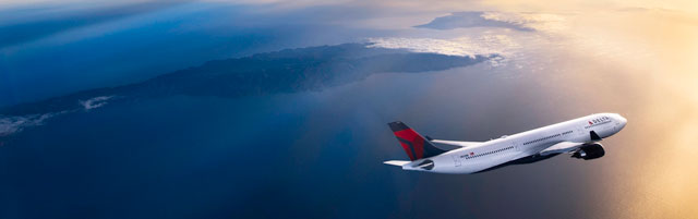 Airplane flying into the sunset